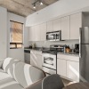 studio apartment with large glass windows and lots of natural light