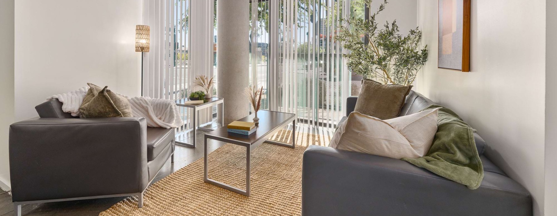 a living room with a couch and chairs