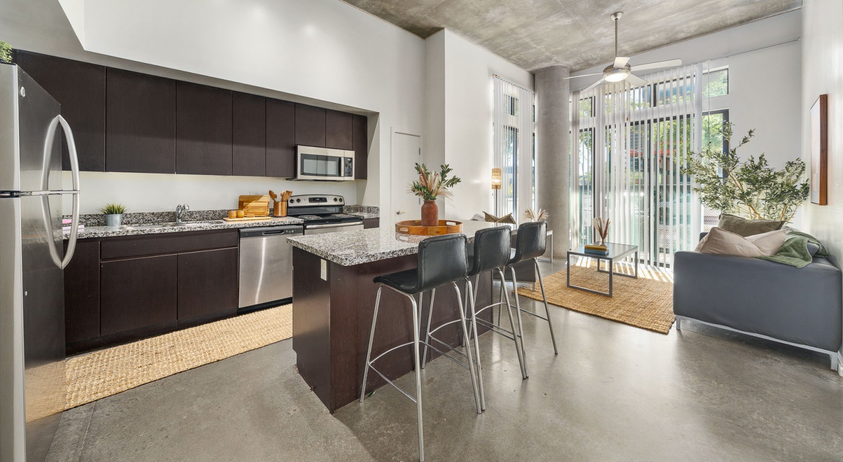 a kitchen with an island and chairs