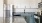 Fully Equipped Renovated Kitchen with Stainless Steel Appliances and White Cabinetry 